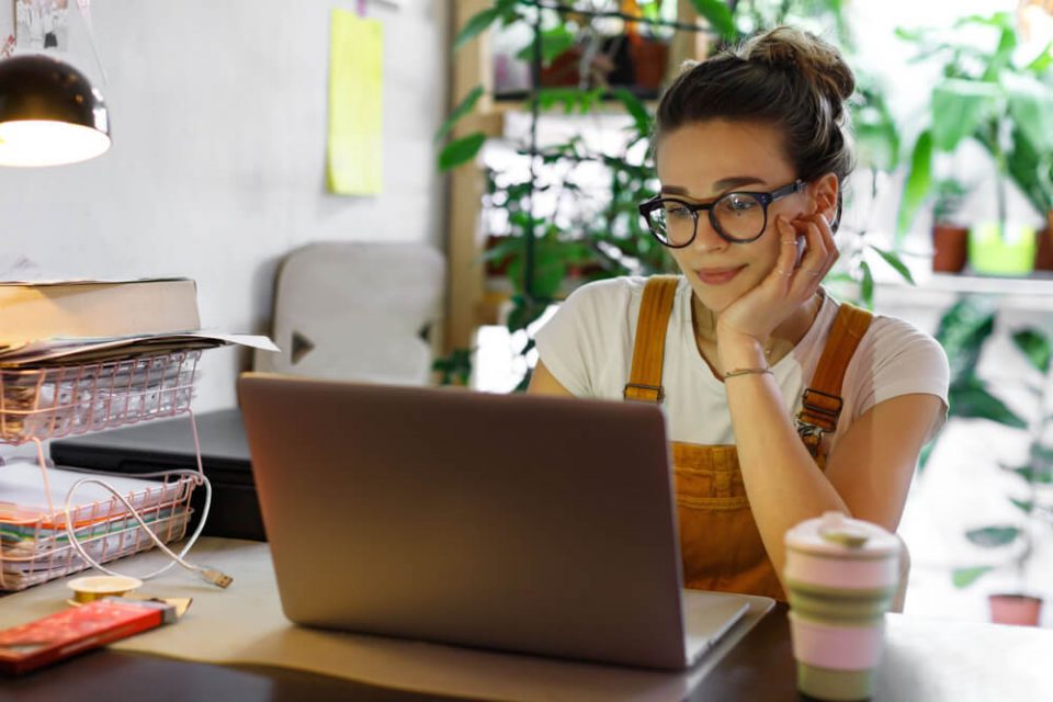 young woman learning on laptop